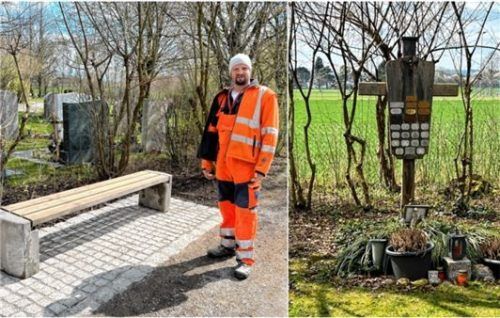 Zum Verweilen lädt auf dem neuen Friedhof nun auch eine Bank an der Urnenwand ein, wie Stadtgärtner Simon Reiter zeigt. Foto Gerlach