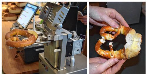 Eine Breze wird in der Bäckerei Brotquelle Prien mechanisch mit Butter gefüllt. Foto Nägele